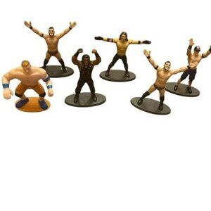 Lot of Collectible WWE metal and plastic figures, trading cards, bracelets, fan